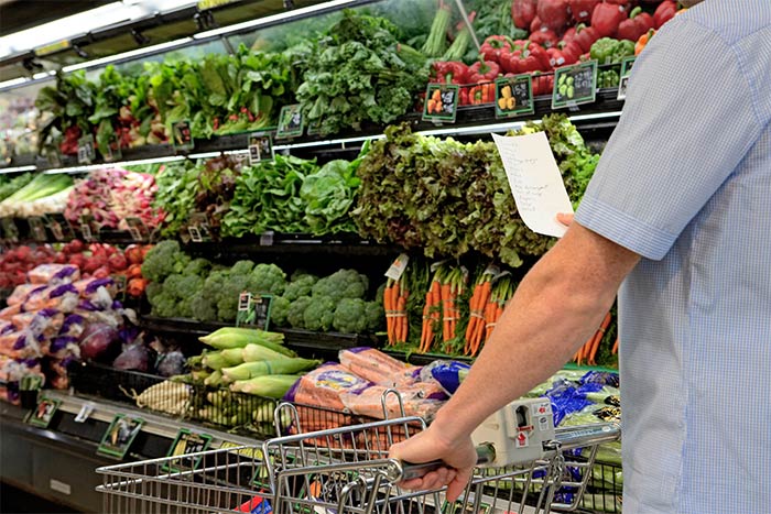 Man shopping the produce section at Jr's Foodland